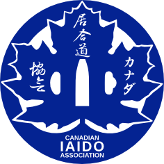 A blue circle enveloping a blue maple leaf with Canadian Iaido Association text in Japanese and English.