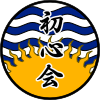 Logo, with the sun rising from below, with the ocean in the background, and the name Shoshinkai vertically superimposed